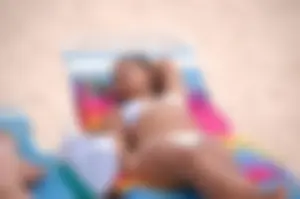 Assortment of sexy babes at the beach in bikinis