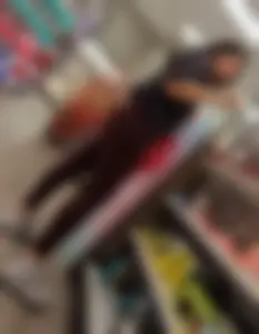 Pretty brunette in red leggings round ass
