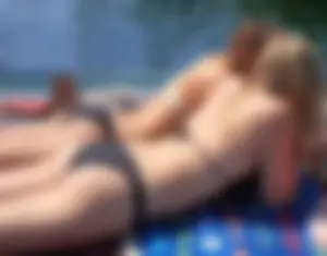 Two sexy blondes laying out in bikinis with nice bodies