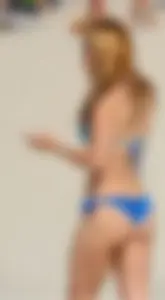 Sexy ass redhead with a great body in blue semi thong bikini