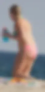 Thick blonde bikini babe on the beach