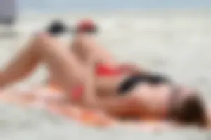Candid Girl With Hot Legs in Swimsuit Pulling Down Her Panties on a Beach And  Photos