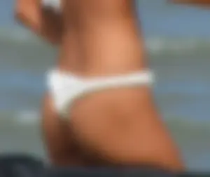 Hot girl at the beach with a nice ass in a white bikini