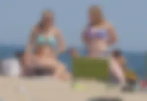 3 girls on the beach in bikinis with big boobs, one brunette and two blondes