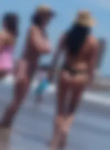 2 milfs in thong bikinis on the beach