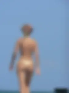 Sexy girls going topless at the beach showing off their sexy bodies