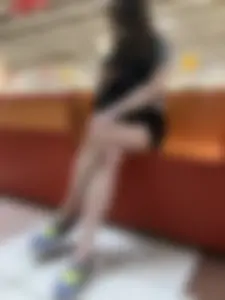 Girl with Hot Long Legs Sitting in the Mall Candid
