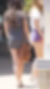 Sexy teen with glasses showing ass cheeks in shorts and friend in tight dress