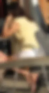 Lady in flop flops while eating showing her feet