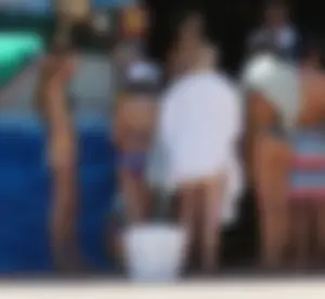 Girls in bikinis getting ready for tubing