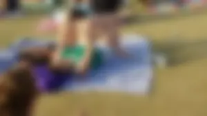 Barefoot Chubby Girl Lying on the Grass in the Park Candid Photo