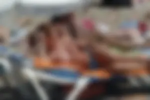 Girls on a nude beach in Sitges, Spain