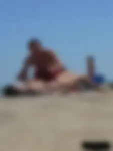 Purple thong topless lady on the beach gets oiled up by her husband