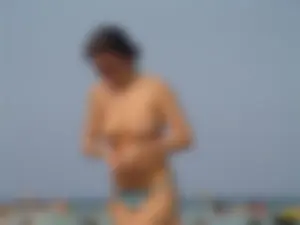 A bunch of sexy beach voyeur babes in bikinis, thongs and topless
