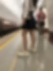 Girl in a Blouse And a Skirt With Great Legs Creepshots Gallery - Standing on the Subway Station, then Sitting With Crossed Legs in a Train