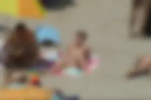 Girls on a nude beach in Sitges, Spain