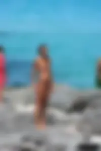 Older lady on a nude beach showing her body