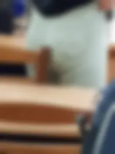 College teen pulling up her tight jeans closeup