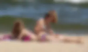 Two sexy beach teens in bikinis, one thick and one skinny with big boobs