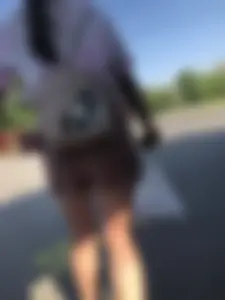 Young Girl in Sandals and Shorts in a Public Bus