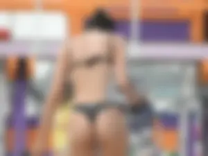Beach girl with an incredible ass in a black thong
