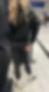 Tight ass sports team in line at airport