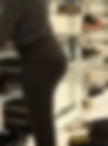 Sexy ass in tight black pants at the store