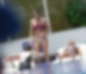 Sexy girl at the pool in a white bikini bottom with slight camel toe
