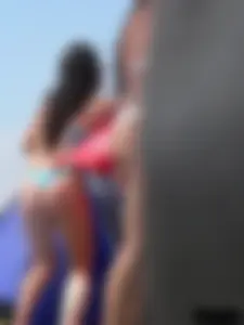 Couple of thick beach teens in little thong bikinis