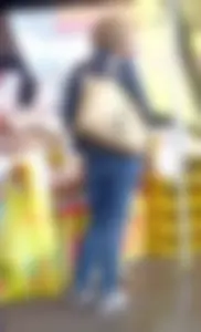 Mature milf in jeans at the street market creepshot