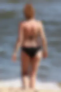 Two sexy beach teens in bikinis, one thick and one skinny with big boobs