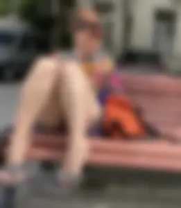 Mature Redhead in a Dress Flashing Panties While Sitting on a Street Bench