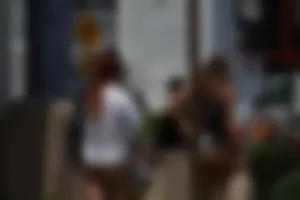 Two sexy friends in Florida walking in thong bikinis with nice asses