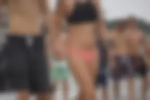 Peach bikini tattood babe on the beach with a nice ass and some camel toe