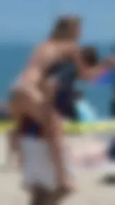 Bunch of sexy babes at the beach in bikinis