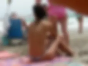 Hot topless girl on the beach in a thong bikini with a nice ass