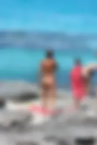 Older lady on a nude beach showing her body