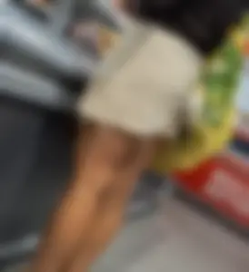 Curly haired woman with huge tits and nice legs