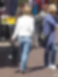 Street candid booties in tight blue jeans