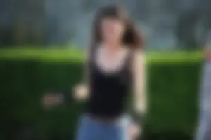 Hot brunette skateboarder in tight jeans and with hard nipples
