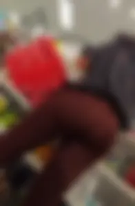 Pretty brunette in red leggings round ass