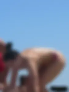 Purple thong topless lady on the beach gets oiled up by her husband
