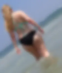 Thick beach blonde in a bikini with a big booty