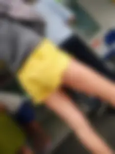 Skinny ass eating her yellow shorts