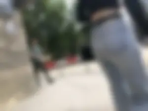 Awesome booty in ripped tight jeans street photos