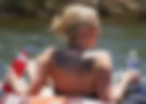 Sexy party girls in bikinis on a lake