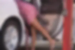 Sexy blonde upskirted in pink dress while cleaning her car