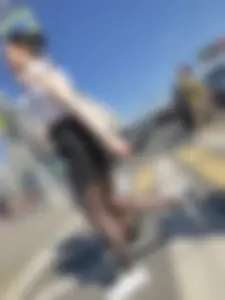 Skinny candid teen wearing shorts and black pantyhose crossing the street