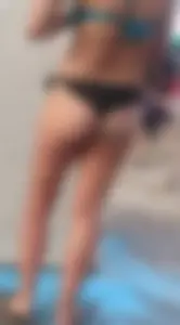 Beach shower milf in semi thong bikini with a nice ass