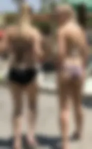 Two sexy blondes at a water park with nice asses in bikinis